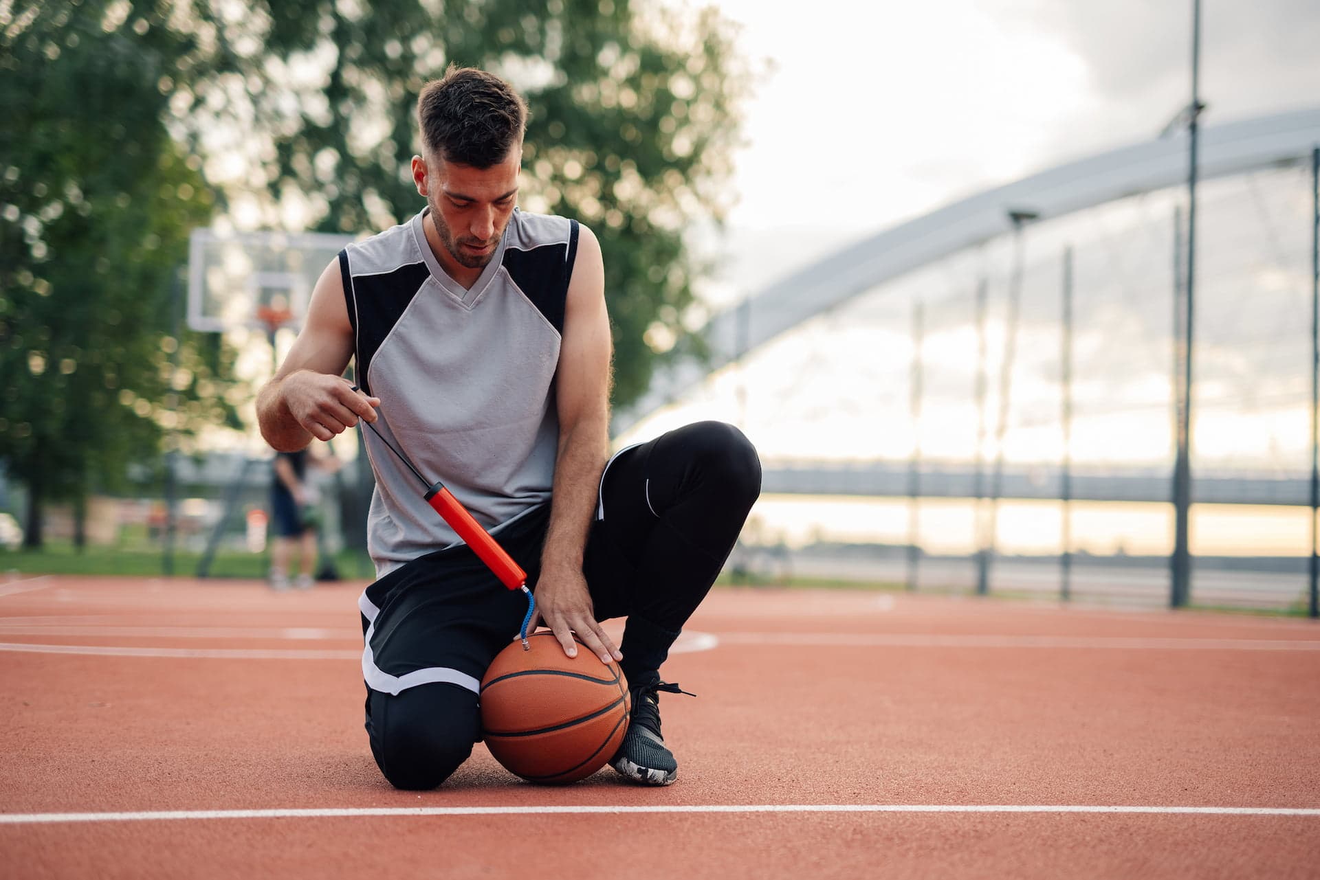 Man inflating a ball